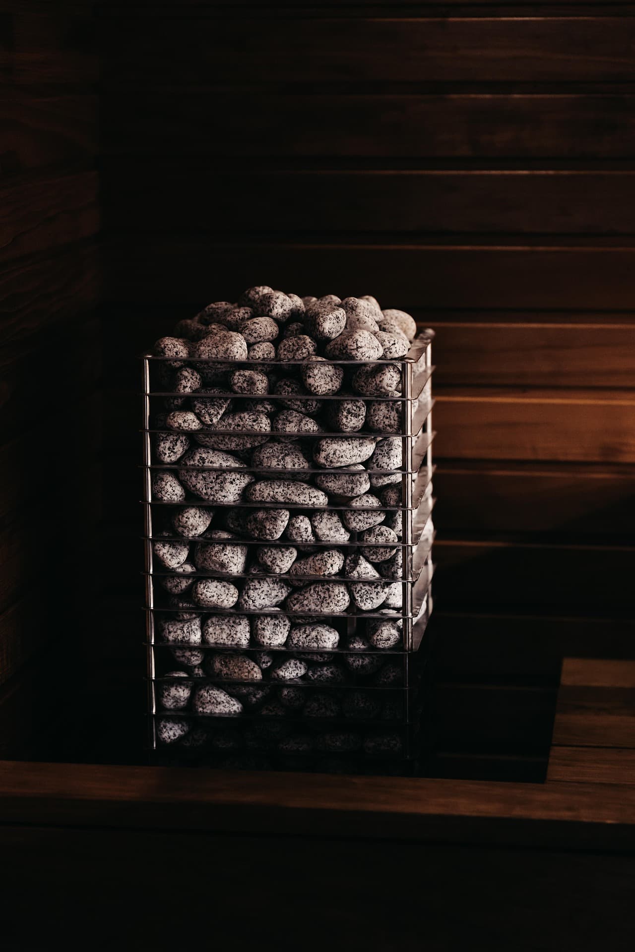 Sauna stones in a wood-panelled sauna